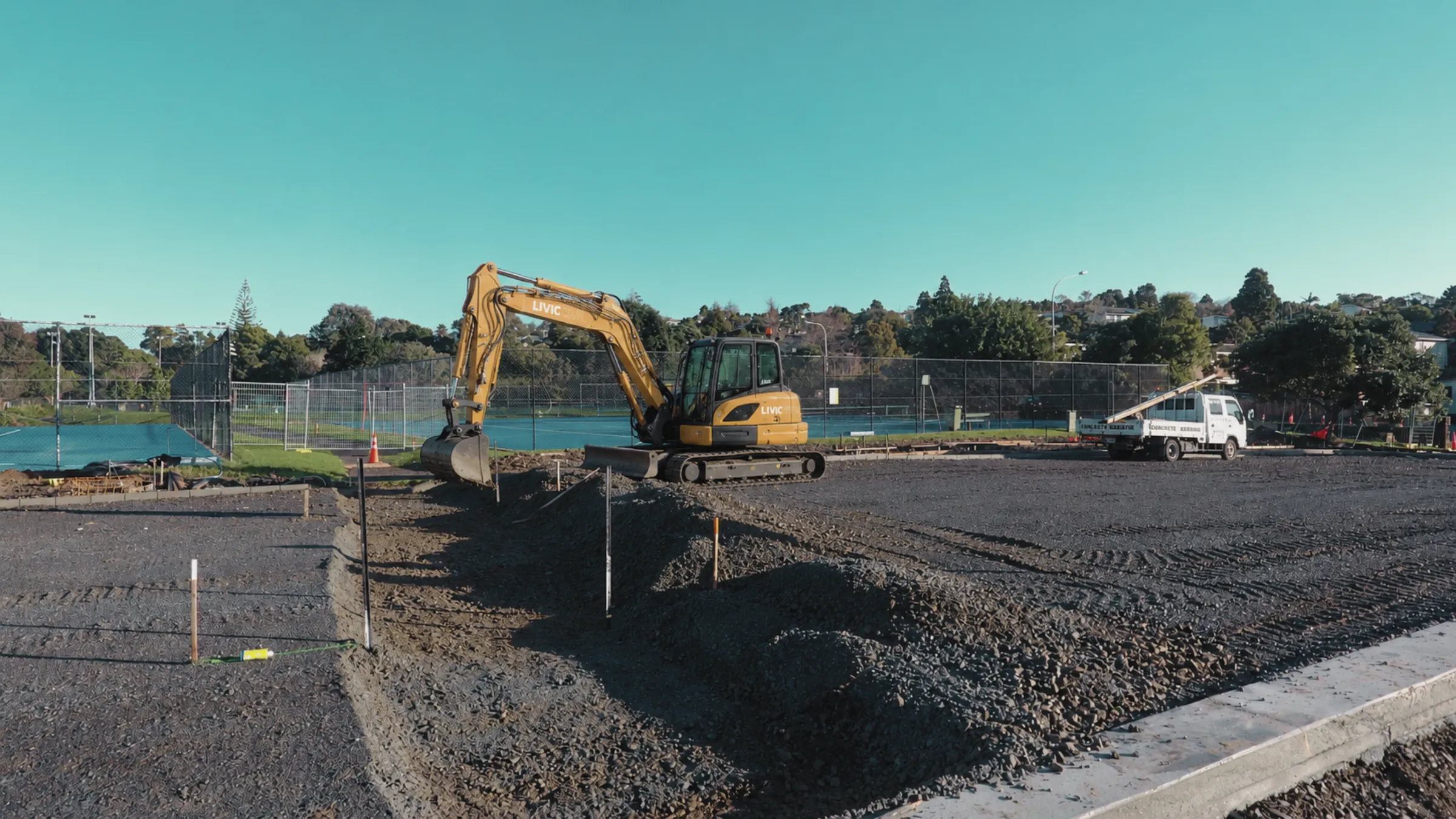 Livic Civil excavator completing detailed earthworks on a prepared site.