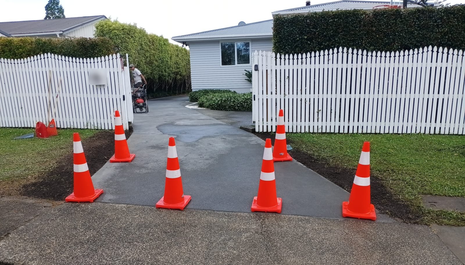 Reconstructed concrete driveway at the street entrance.