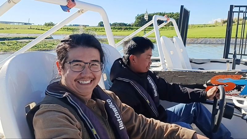 Livic team members on a power boat ride.