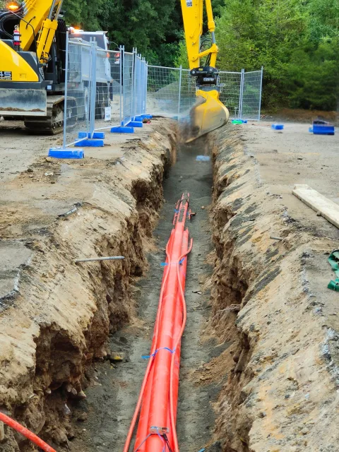 Installed power ducts at a civil works site.